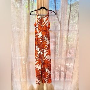 Long Maaji orange and white leaf print jumpsuit with pockets.